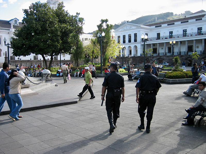 Police patrolling the historical centre of Quito, Ecuador